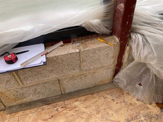 Measuring the steel and blockwork on site