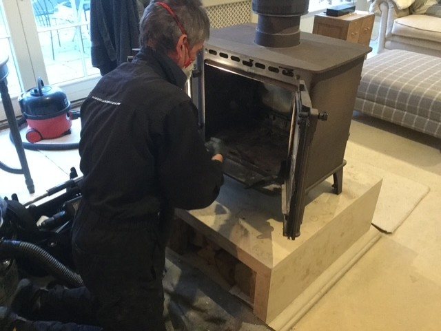 Chimney sweep and stove service in progress