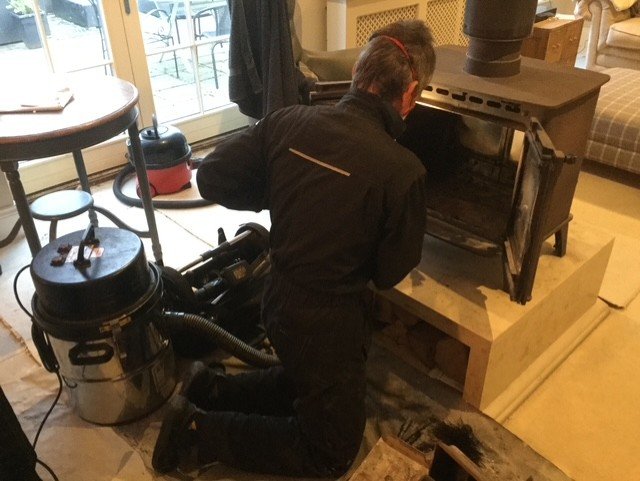 Clean chimney and stove service work before a flue installation
