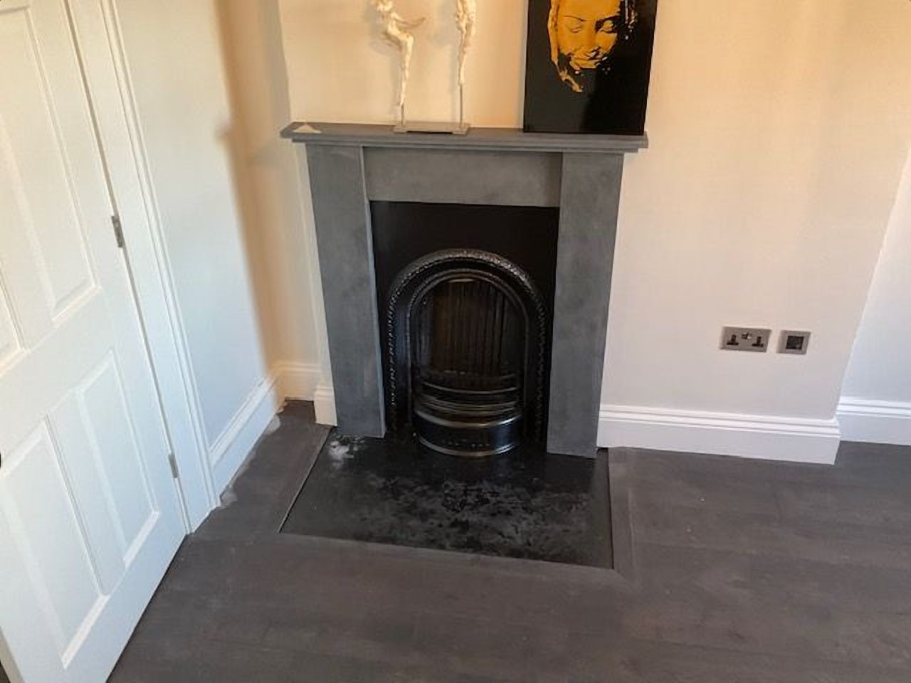 After: the handcrafted slate surround completing the period fireplace
