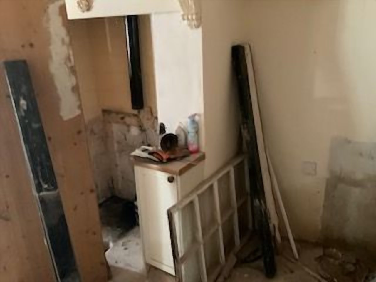 Before: the old tiled chamber ahead of plastering