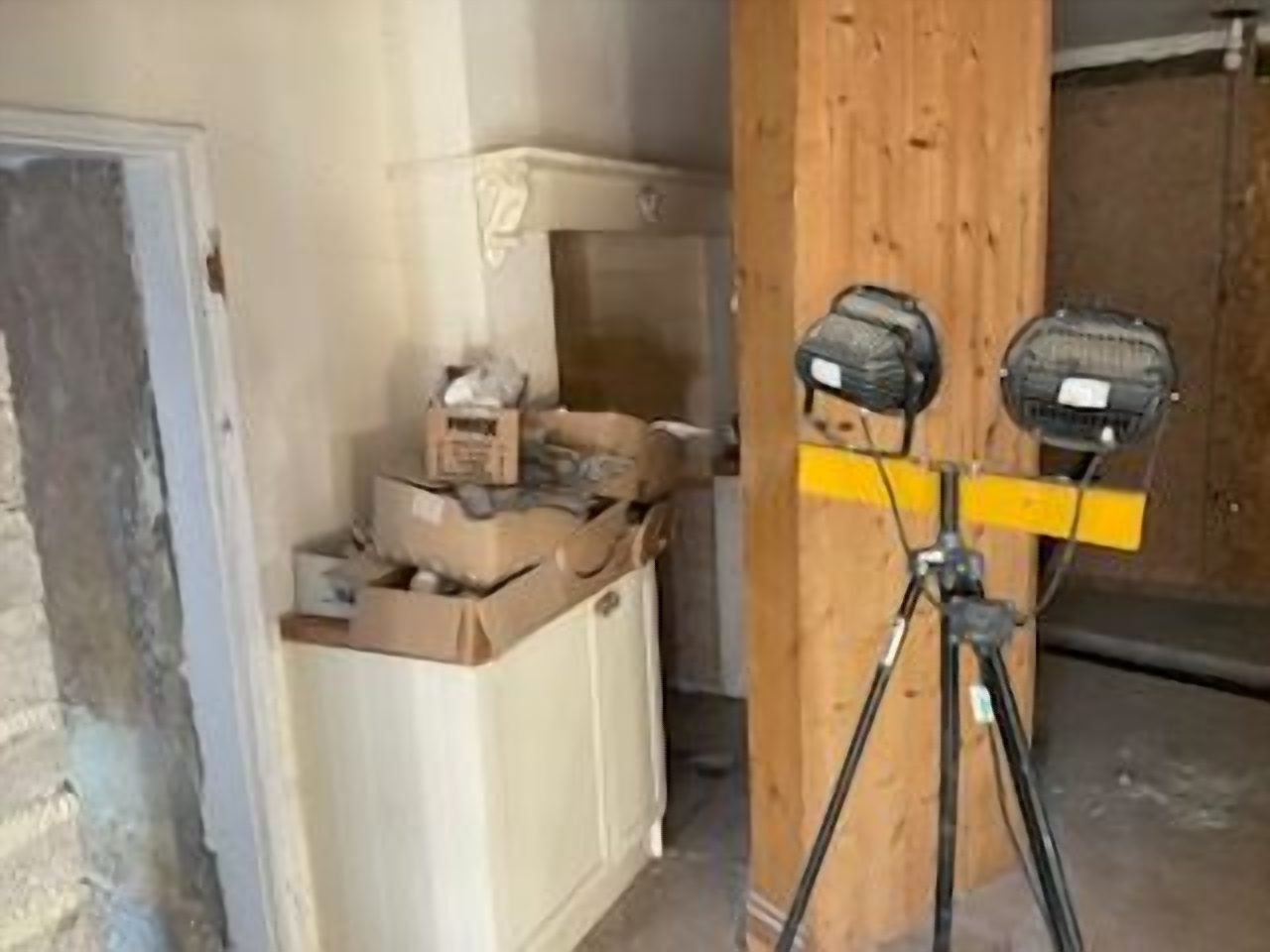 The survey visit, lamps up in the old kitchen