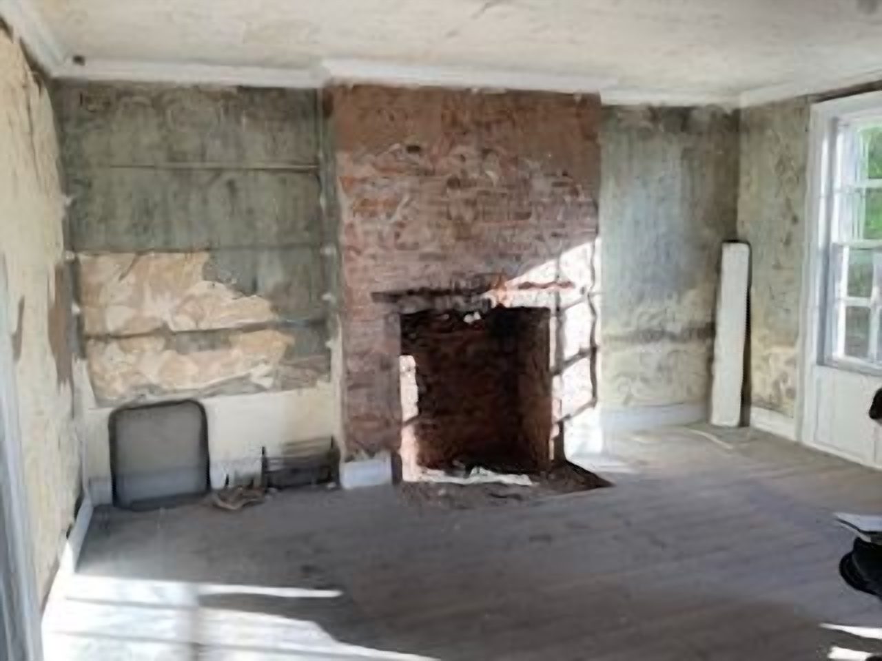 Before: the reception room stripped back to bare masonry