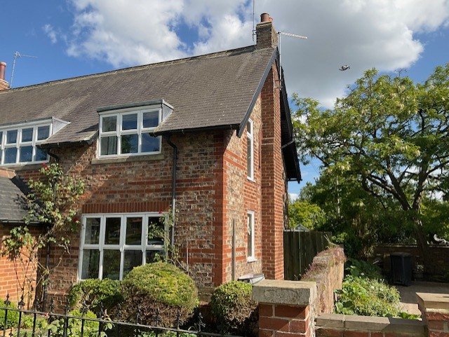 The external chimney breast the new twin-wall flue connects into.