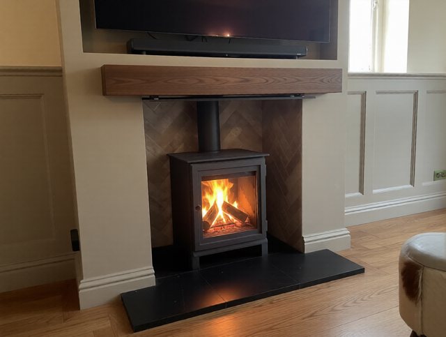 Dik Geurts Soren 5 stove in a bespoke feature chimney breast with oak beam in Thirsk