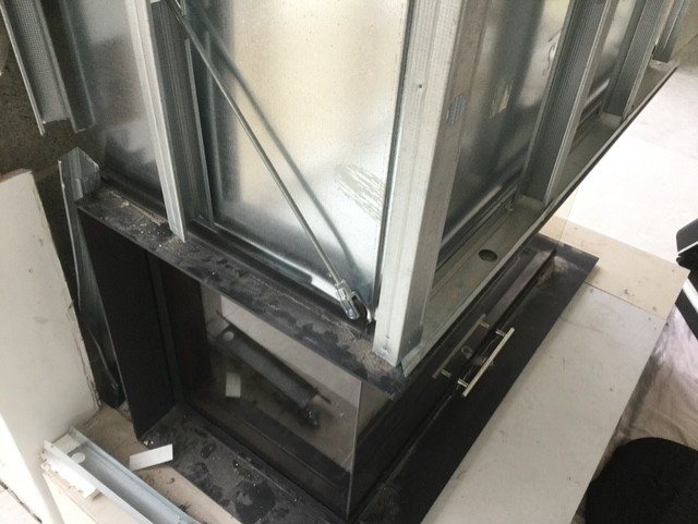 The steel enclosure that houses the guillotine lift-door mechanism