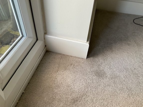 The bare corner at survey, before the hearth was drawn out and cut