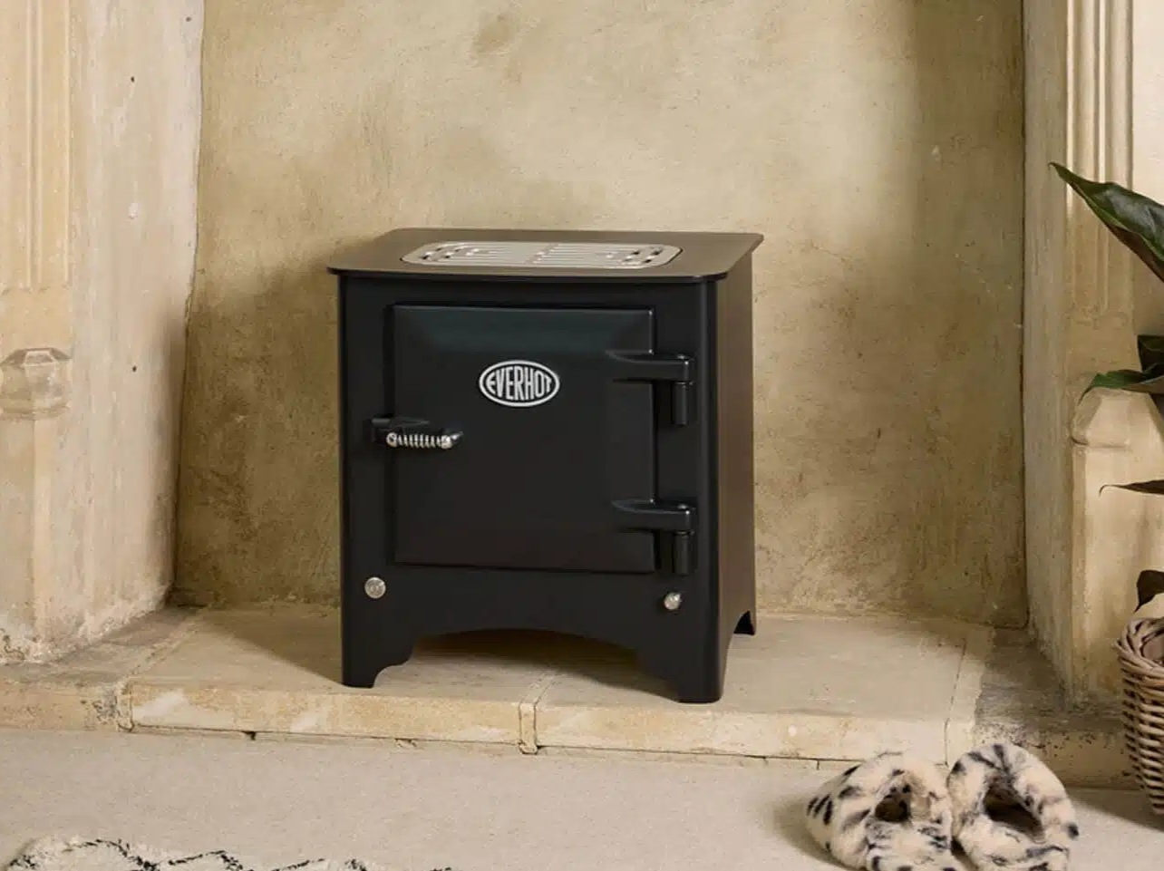 Black Everhot Electric Heater in a fireplace opening