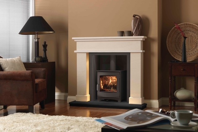 The Aura natural Scala limestone fireplace with deep chamfered edge profiles