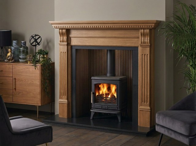 The Caistor waxed oak fireplace surround with an ACR Oakdale stove and ribbed dark walnut chamber
