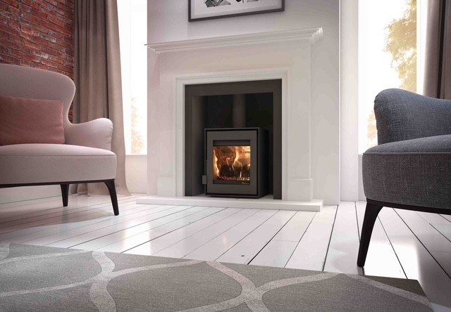 The Deco Step natural Scala limestone fireplace with a stepped Art Deco profile