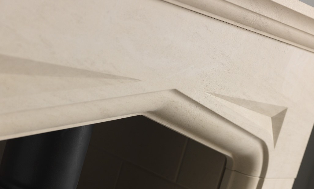 The deep bullnose moulded profile and darting above the Eaton Tudor arch