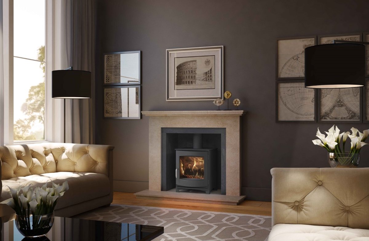 A handcrafted natural limestone fireplace with an inset wood burning stove