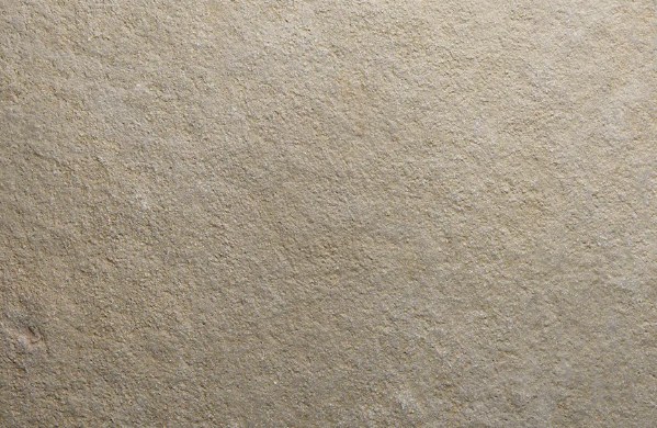 Close up of an aged, hand finished natural stone surface