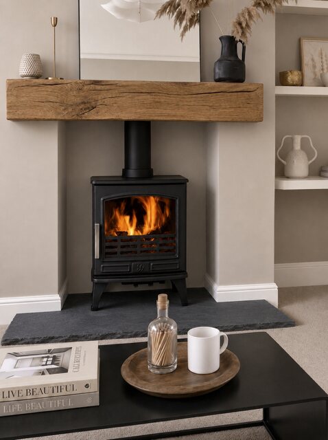 An Old Mill aged black limestone hearth installed