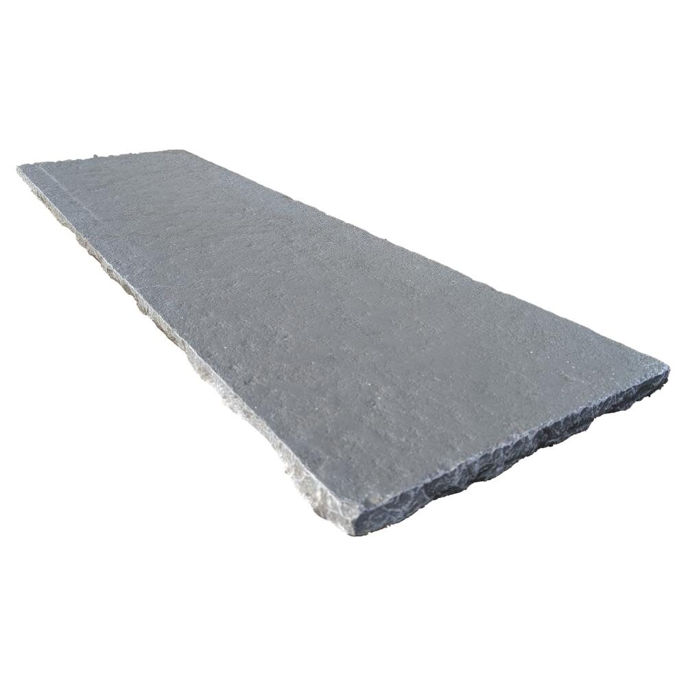 An aged grey limestone hearth