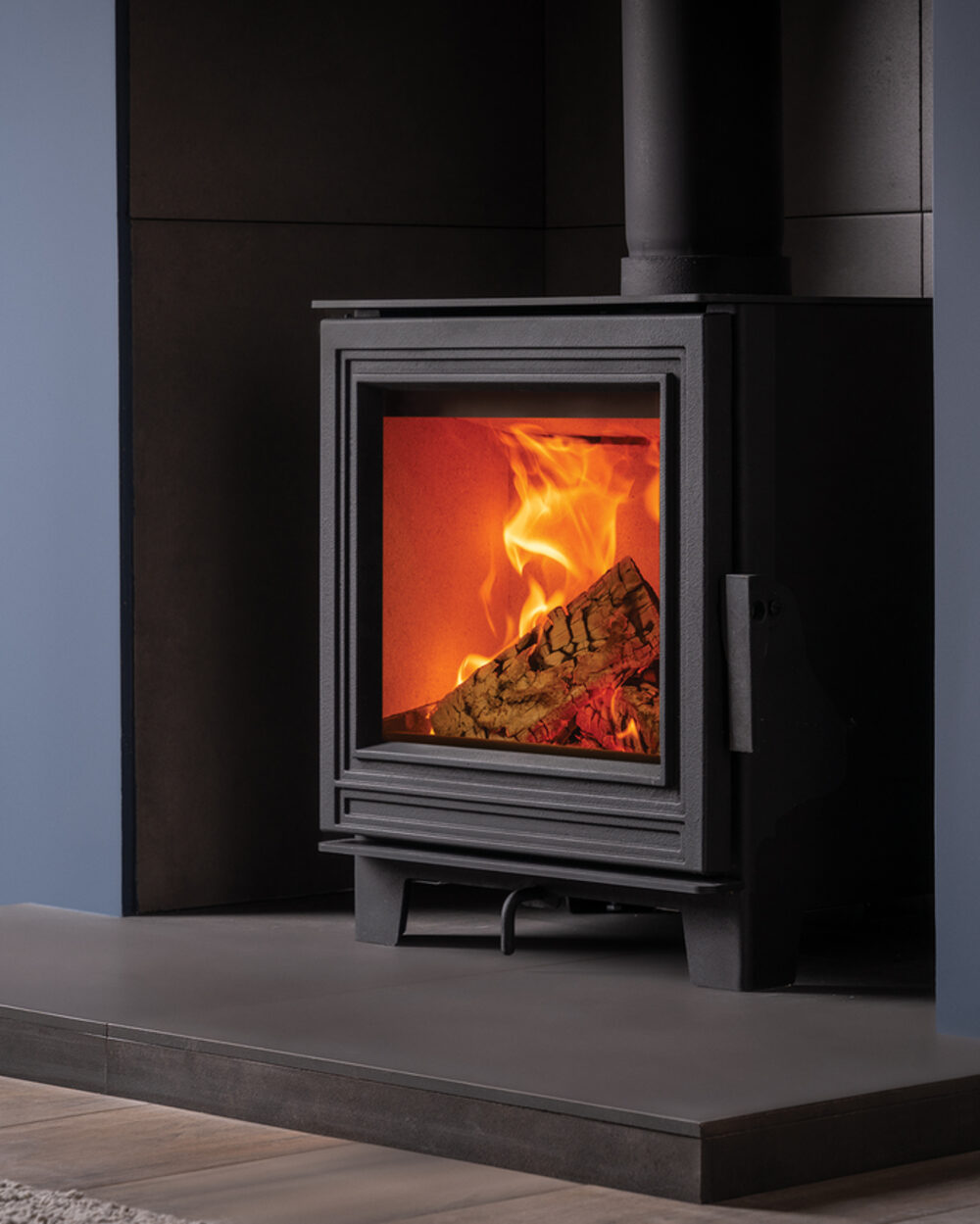 Fire FX Eton 5 stove with a stacked log store